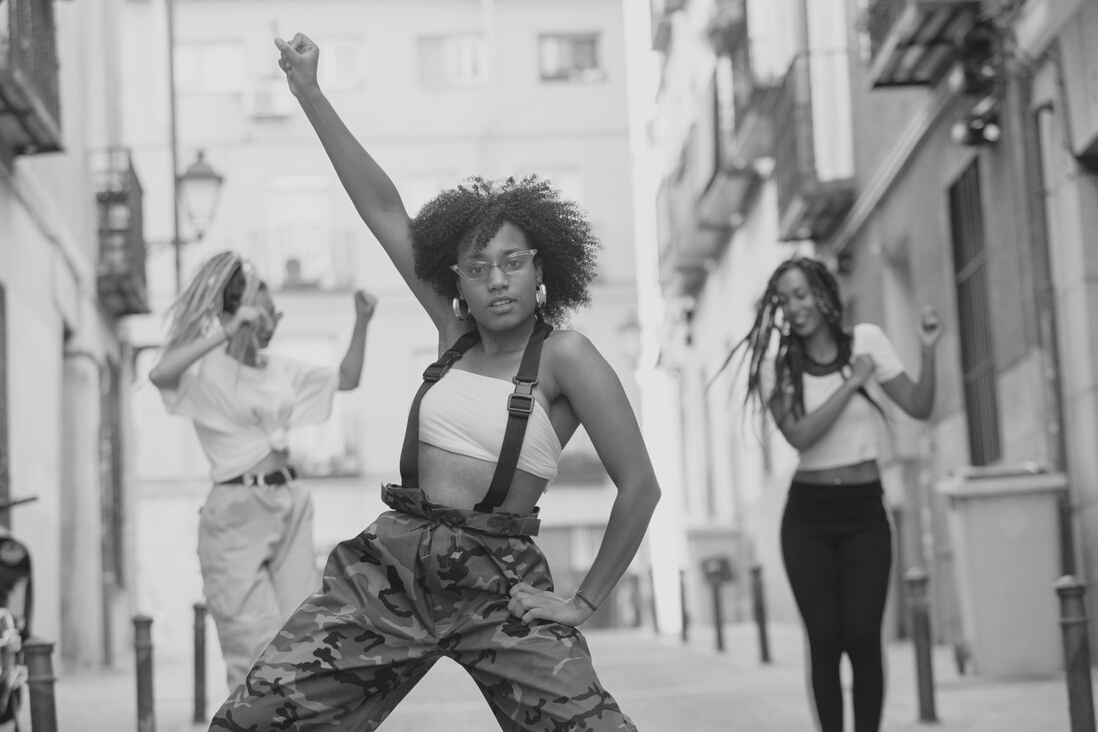 black woman with afro hair dancing